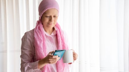 Woman-with-cancer-using-phone.jpg