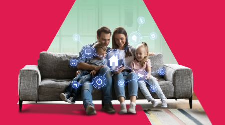 a-smiling-family-on-a-couch-using-a-smartphone-to-interact-with-their-smart-home-surrounded-by-vario.png